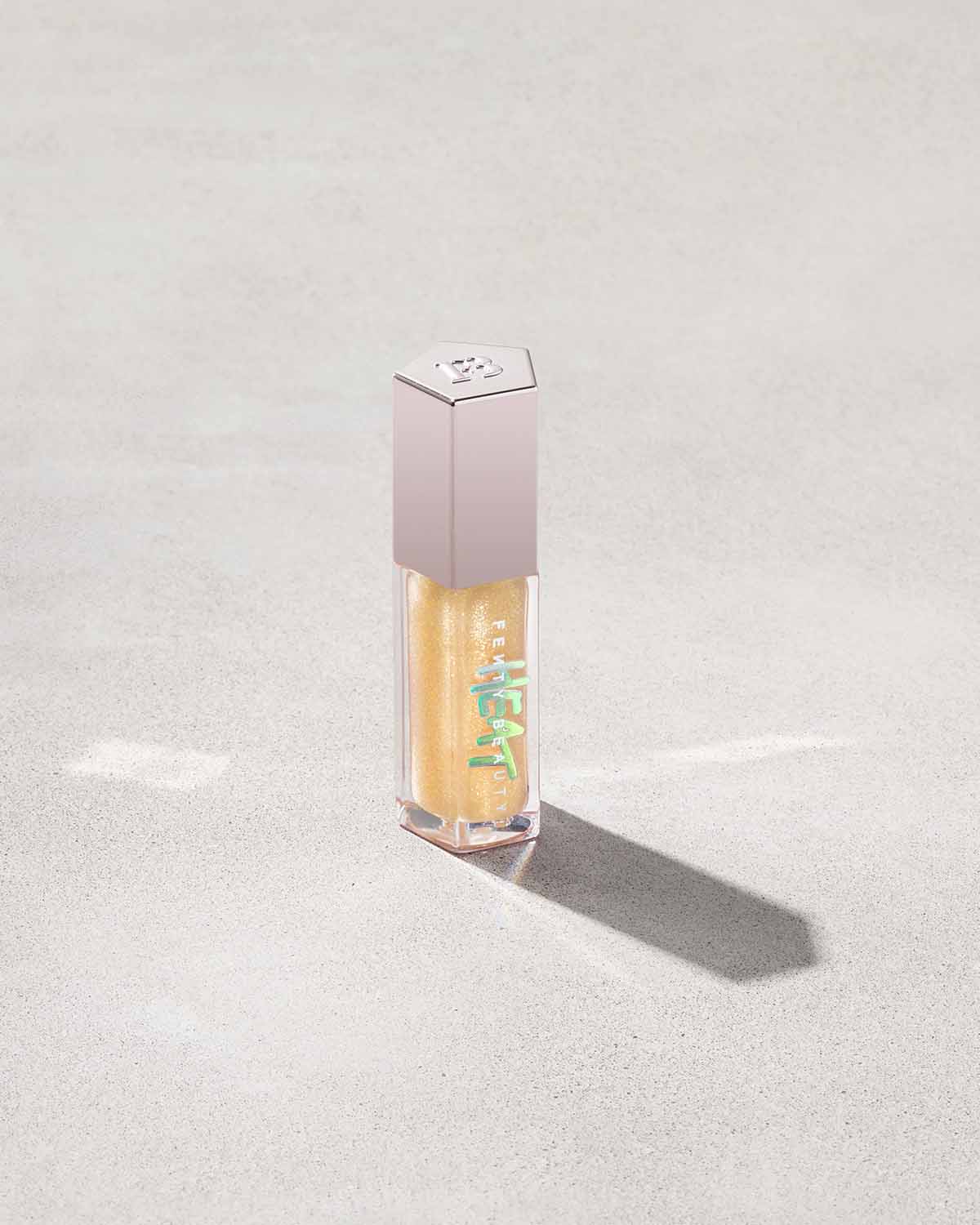FENTY BEAUTY BY RIHANNA  GLOSS BOMB HEAT UNIVERSAL LIP LUMINIZER + PLUMPER  (lemon lava 05)