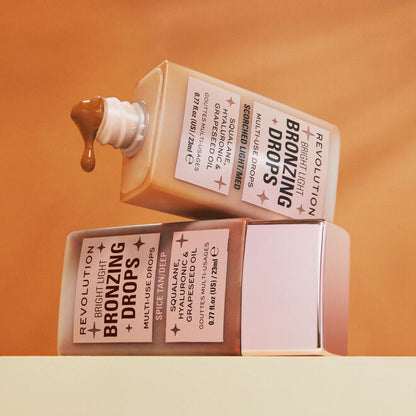 REVOLUTION BEAUTY REVOLUTION BRIGHT LIGHT BRONZING DRP -LIGHT MEDIUM