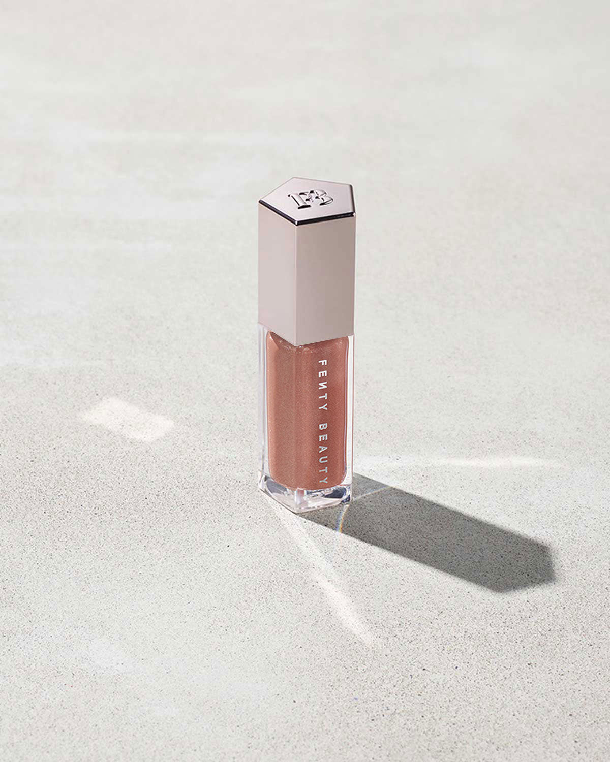 FENTY BEAUTY BY RIHANNA GLOSSBOMB UNIVERSAL LIP LUMINIZER (FENTY GLOW 01)