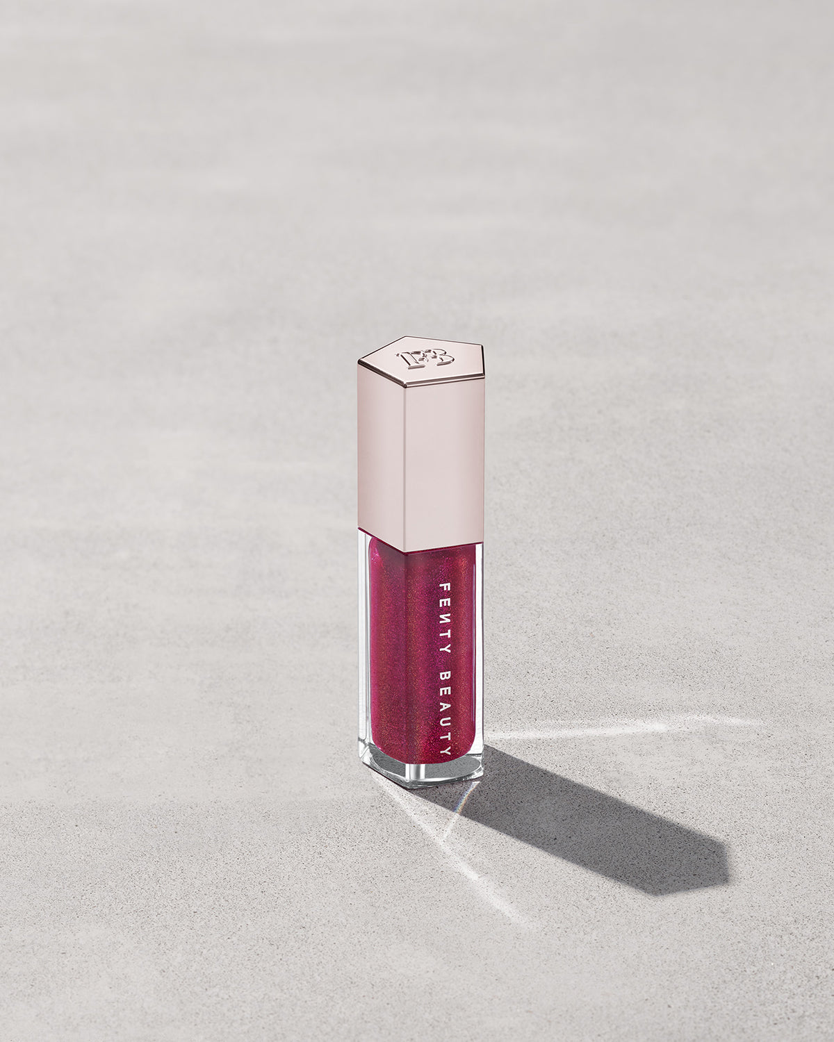 FENTY BEAUTY BY RIHANNA GLOSSBOMB UNIVERSAL LIP LUMINIZER (FUSHIA FLEX)