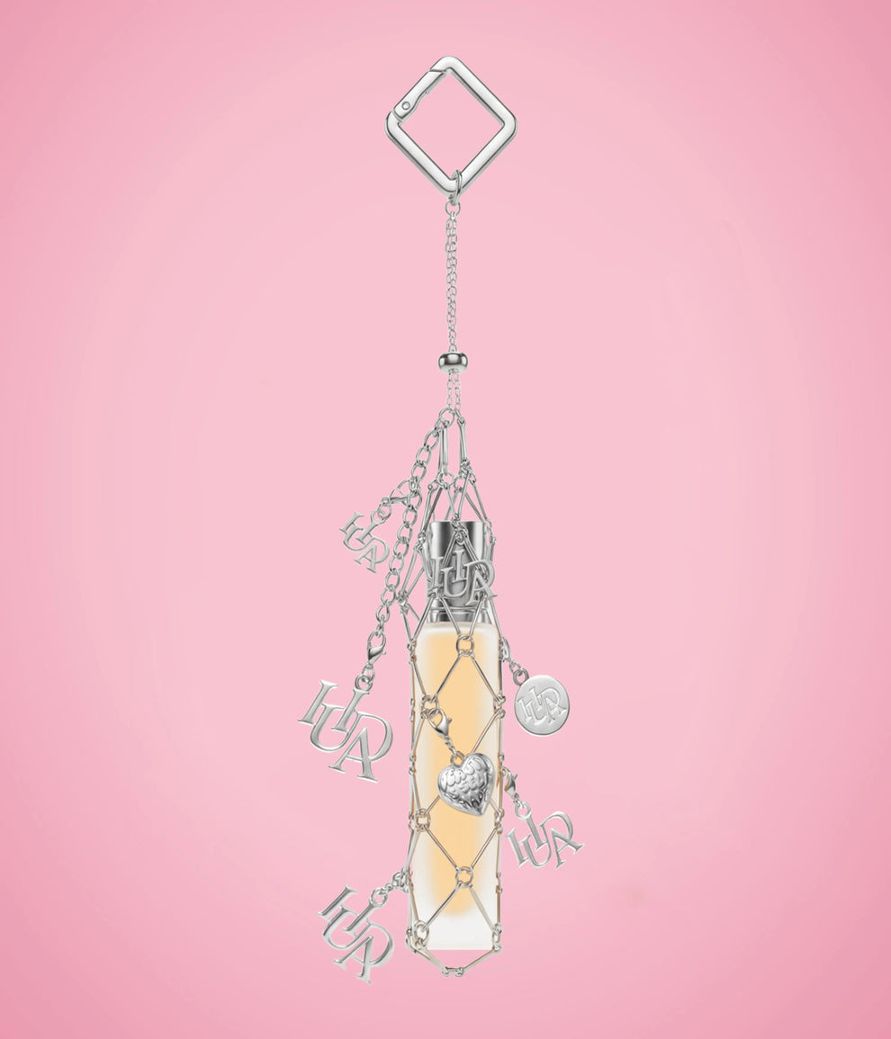 HUDA BEAUTY TRAVEL SPRAY FRAGRANCE HOLDER WITH CHARMS