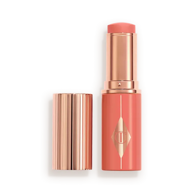 CHARLOTTE TILBURY  UNREAL LIP + CHEEK GLOW BLUSH STICK WITH HYALURONIC ACID (PEACHY GLOW)