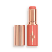 CHARLOTTE TILBURY  UNREAL LIP + CHEEK GLOW BLUSH STICK WITH HYALURONIC ACID (PEACHY GLOW)