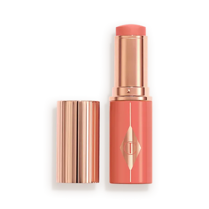 CHARLOTTE TILBURY  UNREAL LIP + CHEEK GLOW BLUSH STICK WITH HYALURONIC ACID (PEACHY GLOW)